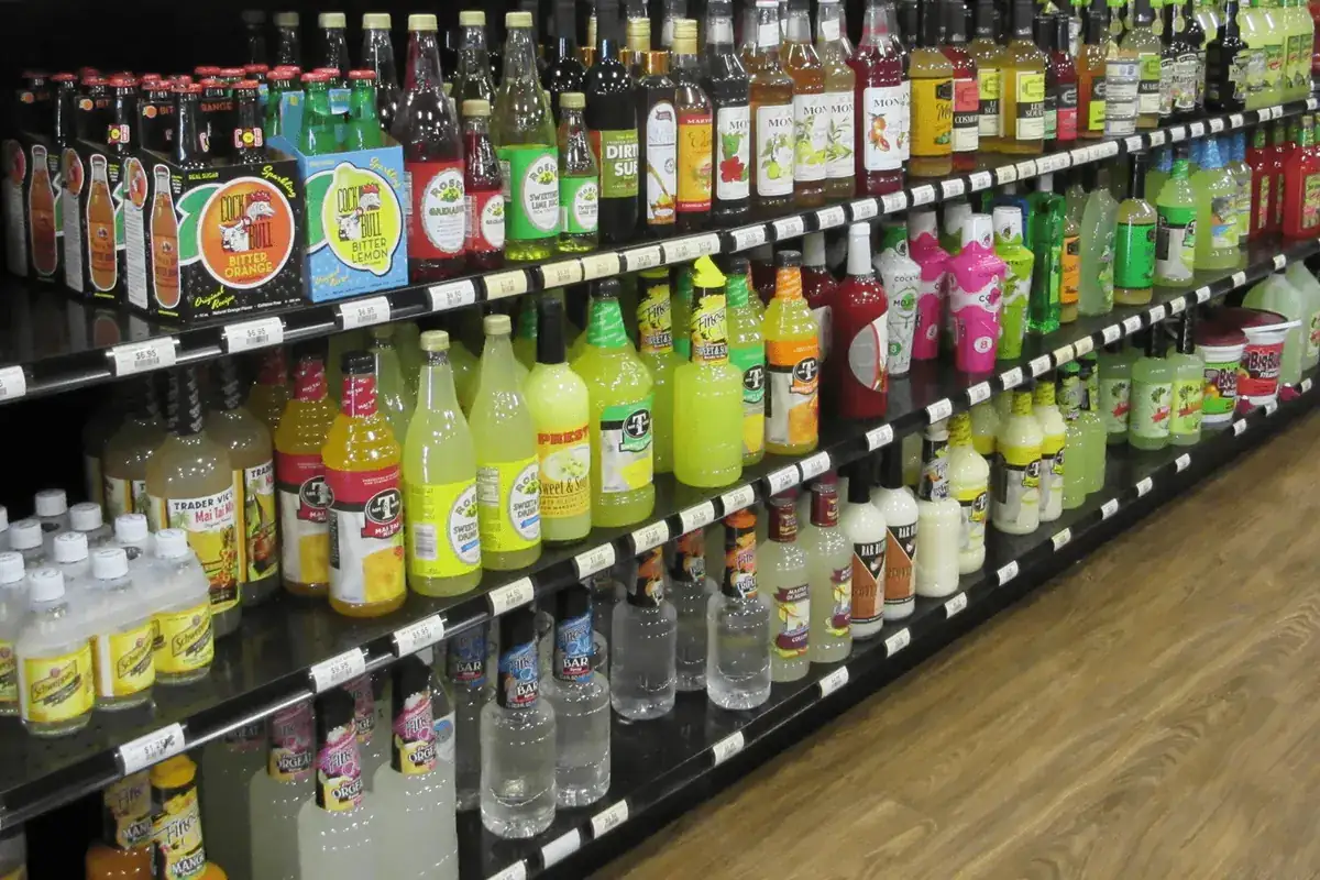 Shelves of mixers, syrups and bar supplies inside the store
